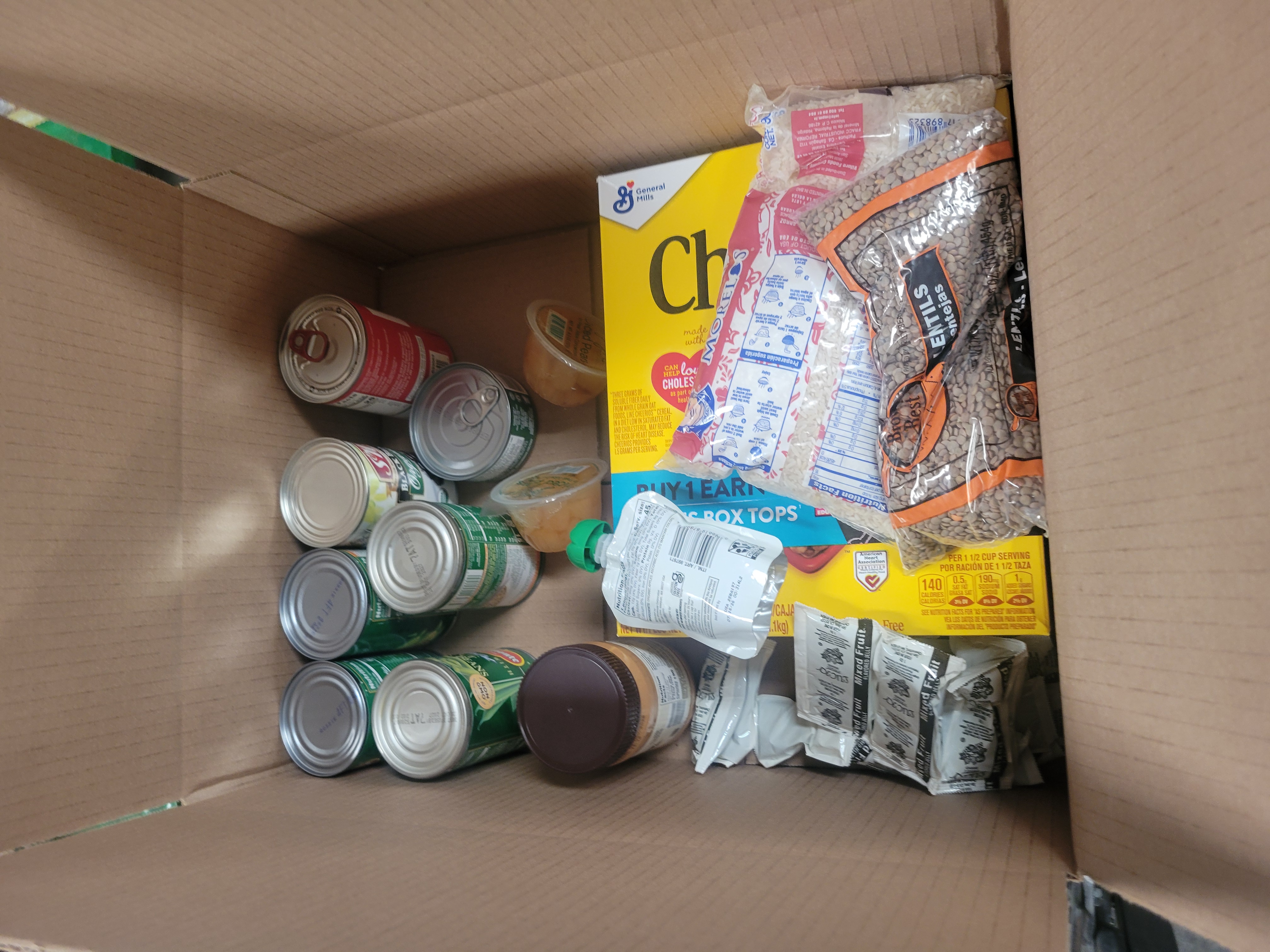 Cardboard box filled with dry goods.